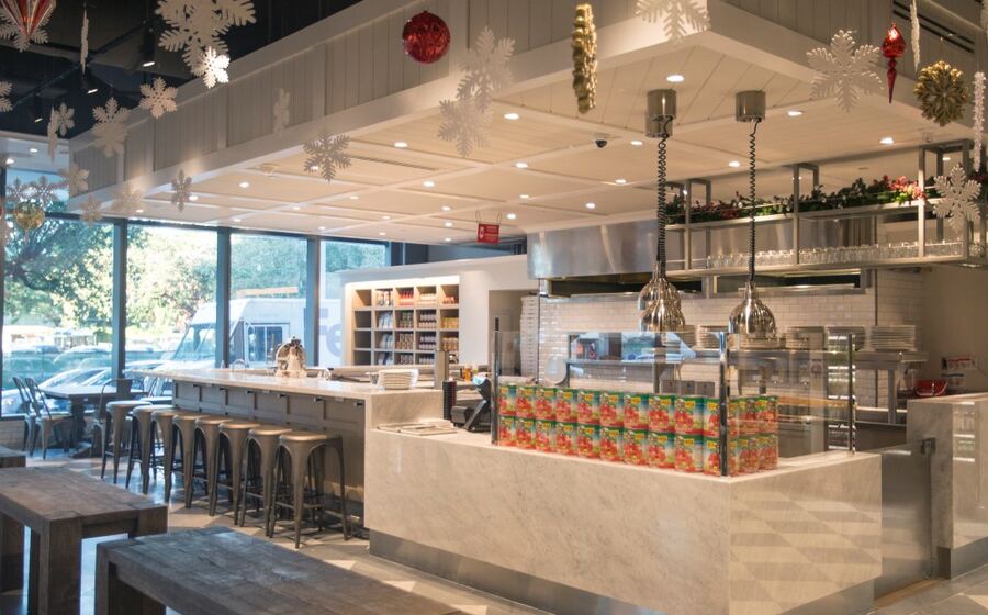 Open kitchen and dining stations at Casa Tua Cucina